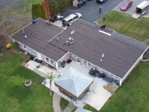 Top view of a house along with parked cars